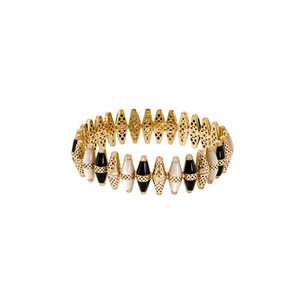 A gold-plated stretch bracelet featuring alternating textured gold spacer beads and smooth black and cream beads, set against a plain light blue background.
