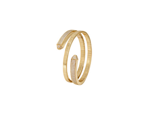 A gold open cuff bangle bracelet with pavé-set clear stones on both arrow-like ends, photographed on a clean white background.